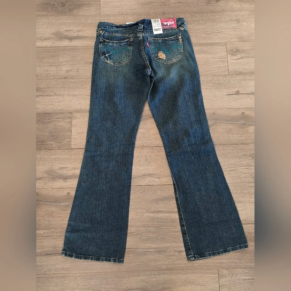 Levi's Distressed Flare Jeans in Dark Blue - Picture 2 of 2